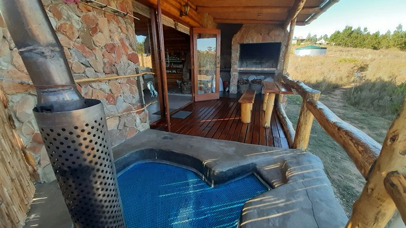 BushCat's wood-fired hot tub beside the donkey geyser chimney