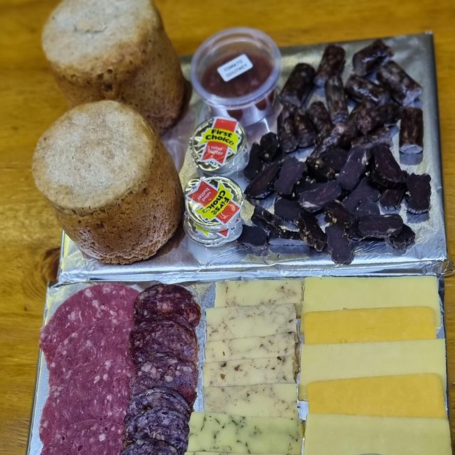 A snack platter with biltong, droëwors, cheeses and sausage
